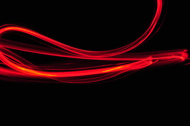 istock red orange lines trace on black background 186233066