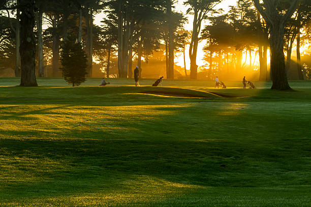 Background evening golf course has sunlight shining down at golf course in Thailand