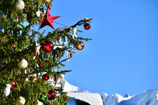 Decorated Christmas tree with blue sky background