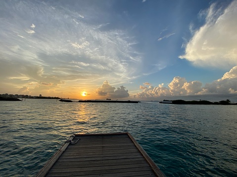 Beautiful tropical sunset seen from a pier in Maldives