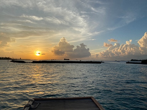 Beautiful tropical sunset seen from a pier in Maldives