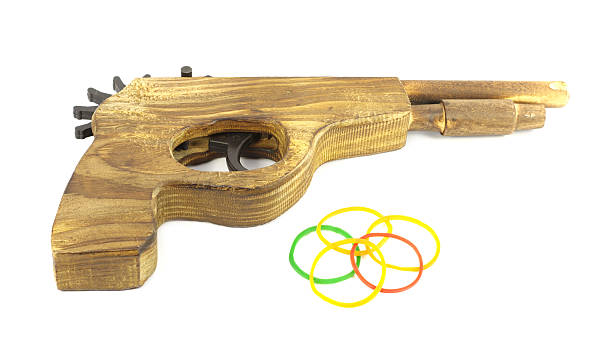 istock Wooden Catapult Gun with rubber on white background 186235585