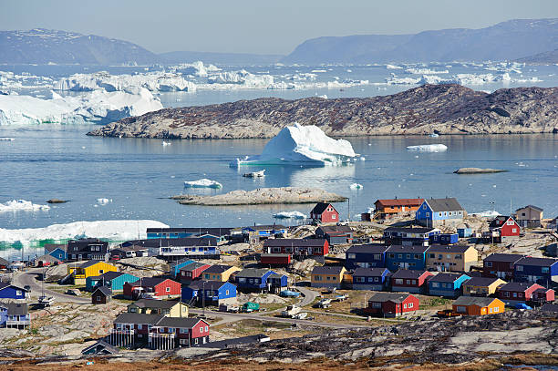 View over Illulisat, Greenland View overlooking the town of Illulisat, Greenland. Picture taken from a nearby hill disko bay stock pictures, royalty-free photos & images