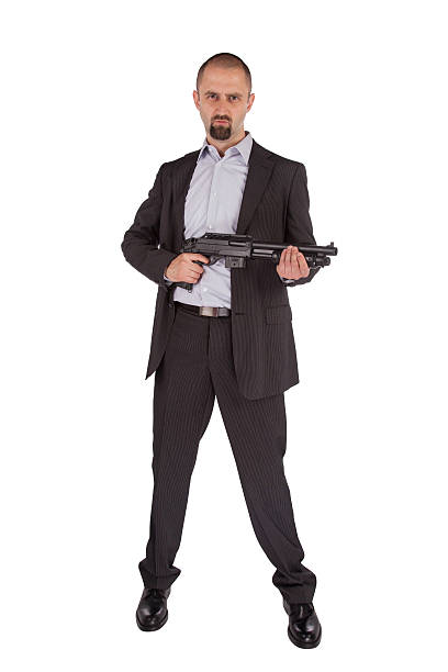 istock Mafia man is holding a shotgun 186236762