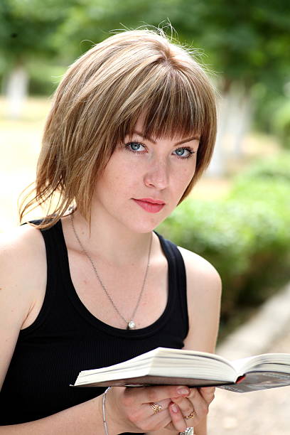istock Attractive girl student with book 186238391