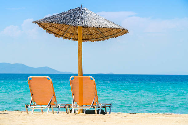istock Seaside relaxation sunbed - Stock Image 186238863