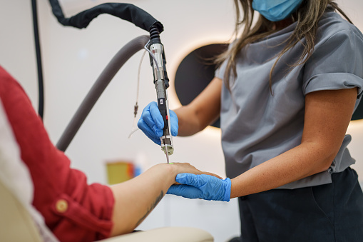 Part of a series of a woman at dermatology clinic.