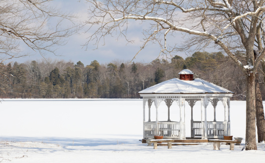 Gazebo next to a frozen lake after a winter snow in New Jersey