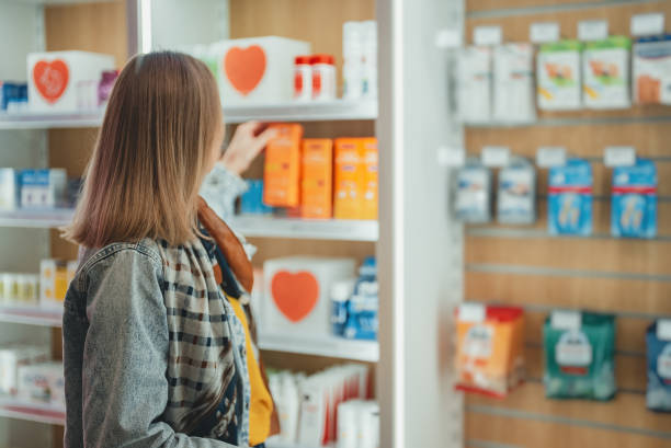 istock Woman chooses medicine at a pharmacy. 1862412502