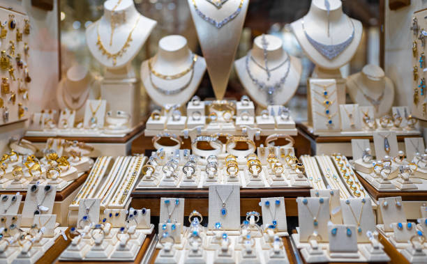 istock Rings, chains and earrings on a store window. 1862413565