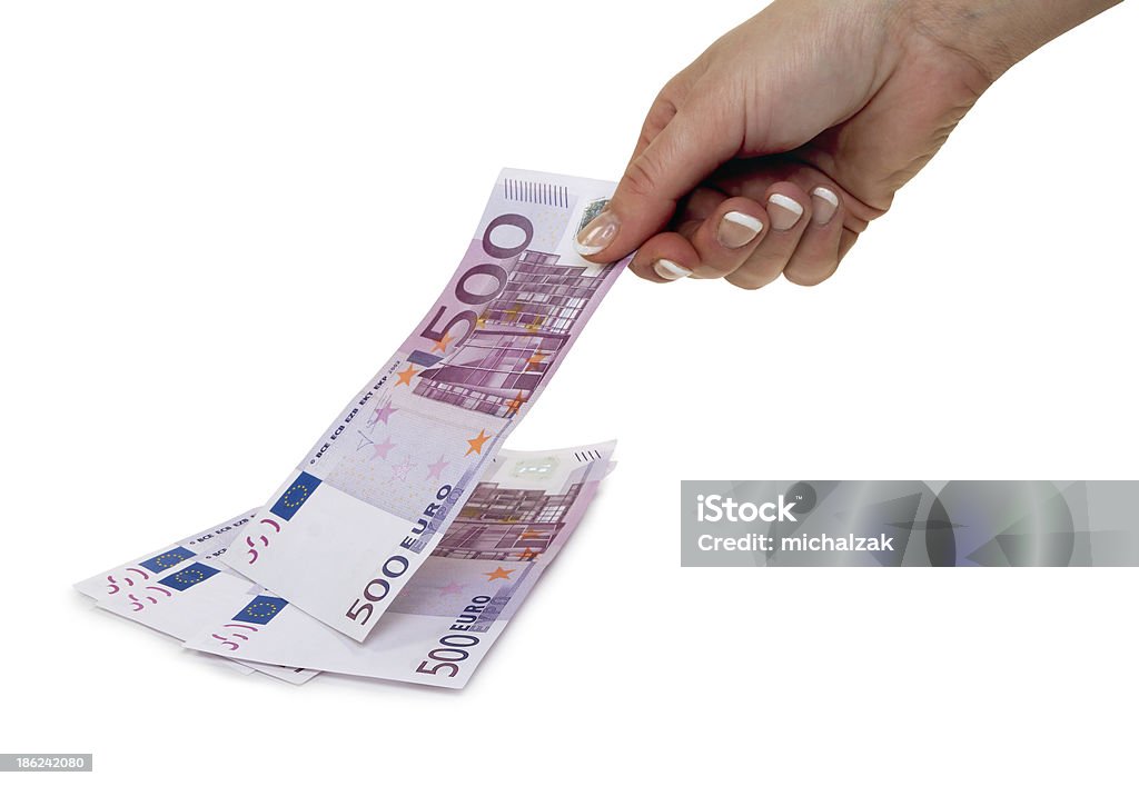 Taking money Female hand takes 500 euros from the pile, isolated on white Adult Stock Photo