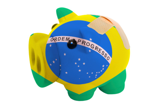 epty poor man piggy rich bank in colorsnational flag of brazil on white