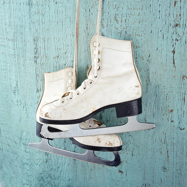 istock Ice skates on blue vintage wooden background 186244579
