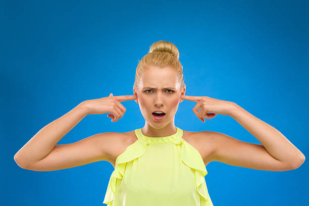 istock Beautiful woman closes her ears. 186244726