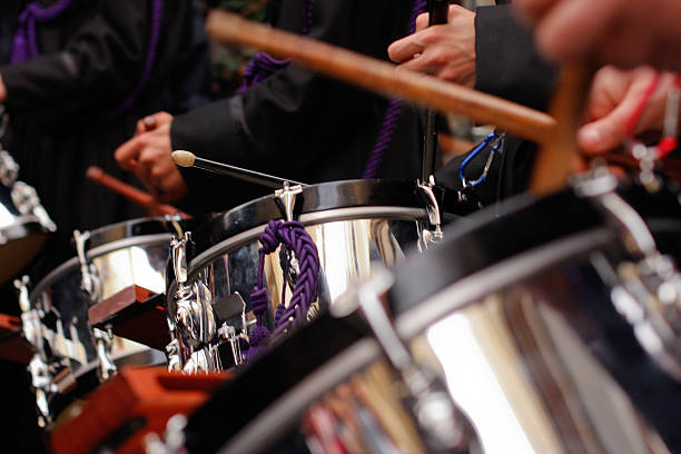 Drums Drums accompany the march of the penitents of Holy Week in León, Spain. religious celebration audio stock pictures, royalty-free photos & images