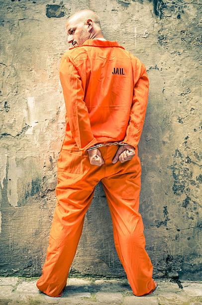 istock Dead Man Walking - Prisoner with Handcuffs standing proud 186245169