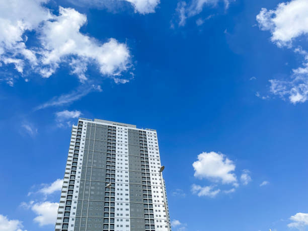 Free Stock Photo of Tall apartment building under a beautiful blue sky ...