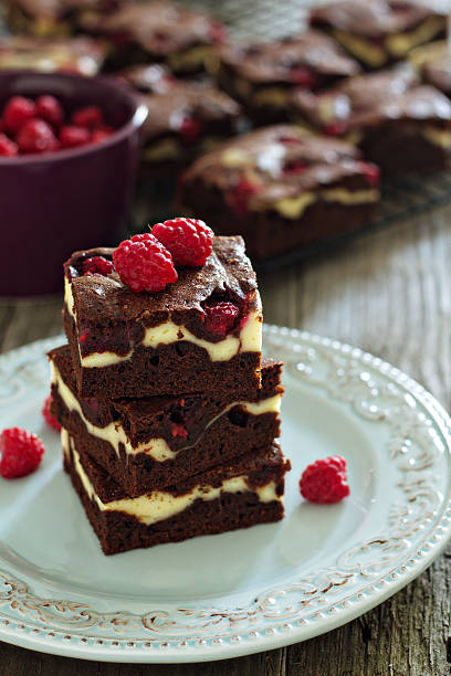 istock Cheesecake brownies with raspberry stacked on a plate 186247560