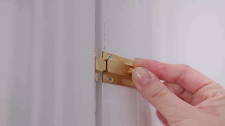 Woman closes door with stainless steel latch