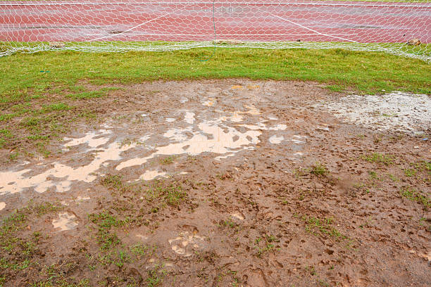 A lone baseball sits in the mud, and this game is postponed in southern Florida.