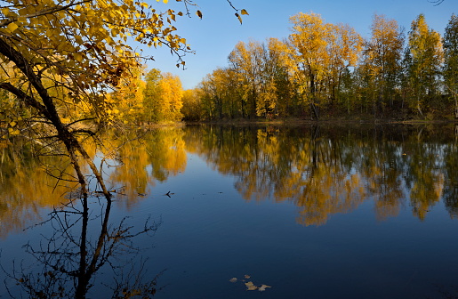 Russia. South of Western Siberia, Kuzbass. A windless sunny evening at the Pritomsky quarries of Novokuznetsk in the middle of autumn.