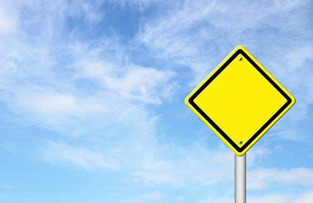 istock blank yellow traffic sign with blue sky 186251607