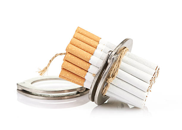 istock Addition concept with cigarettes and handcuffs 186253999
