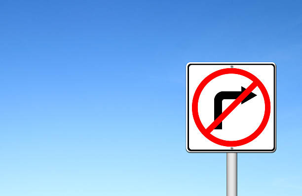 istock Road sign don't turn right over blue sky 186254672