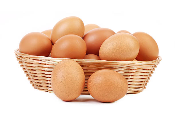 istock Brown eggs in the basket on white 186254963