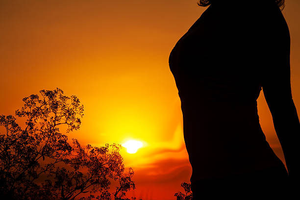istock Silhouette of  woman's body at sunset 186257317