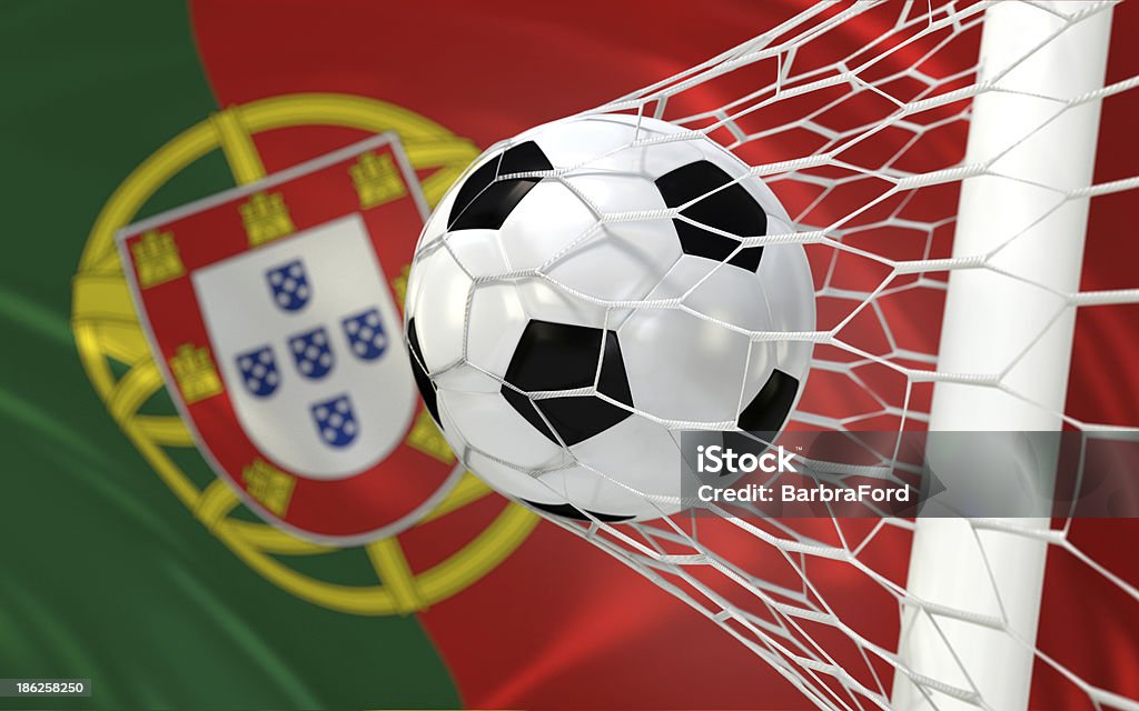 Portugal waving flag and soccer ball in goal net Soccer, football ball in goal net  Color Image Stock Photo