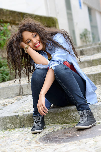 istock Attractive mixed woman in urban background 186259297