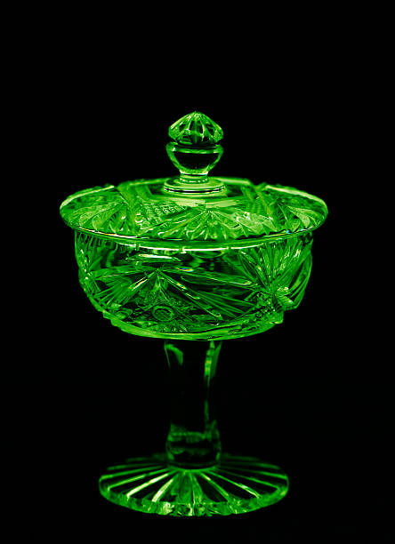 Antique bright crystal holder with lid Antique bright crystal holder with lid isolated on black background crystal chalice stock pictures, royalty-free photos & images