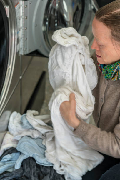 istock Women using washing machine at Public Laundromat Service 1862626548
