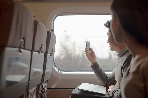 istock Young man taking a photo out the window 186262691