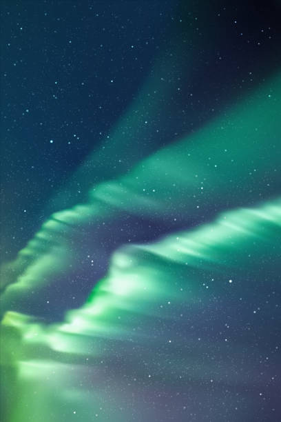 istock Night starry sky and Northern lights. Green aurora borealis 1862641240