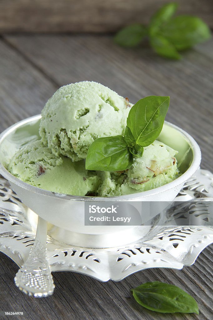 Green ice cream with basil, mint and nuts. Basil Stock Photo