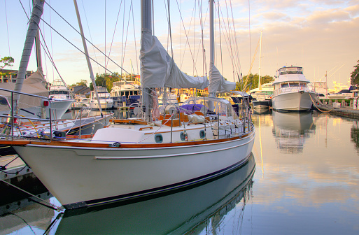 Sailboats and motor lunches line the pier at the Cambridge Maryland yacht club on a winter morning