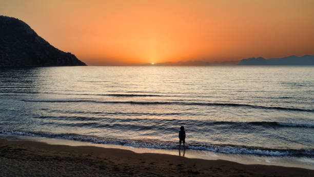 istock Sunset Silhouette by the Sea 1862693057