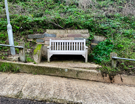 Old wooden bench by the sea at Cromer in Norfolk