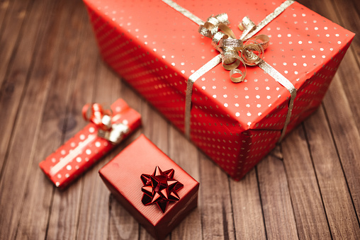 White gift box with orange ribbon isolated on white color background.