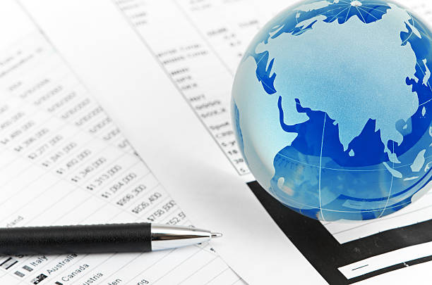 istock Glass globe and pen on finance 186271464