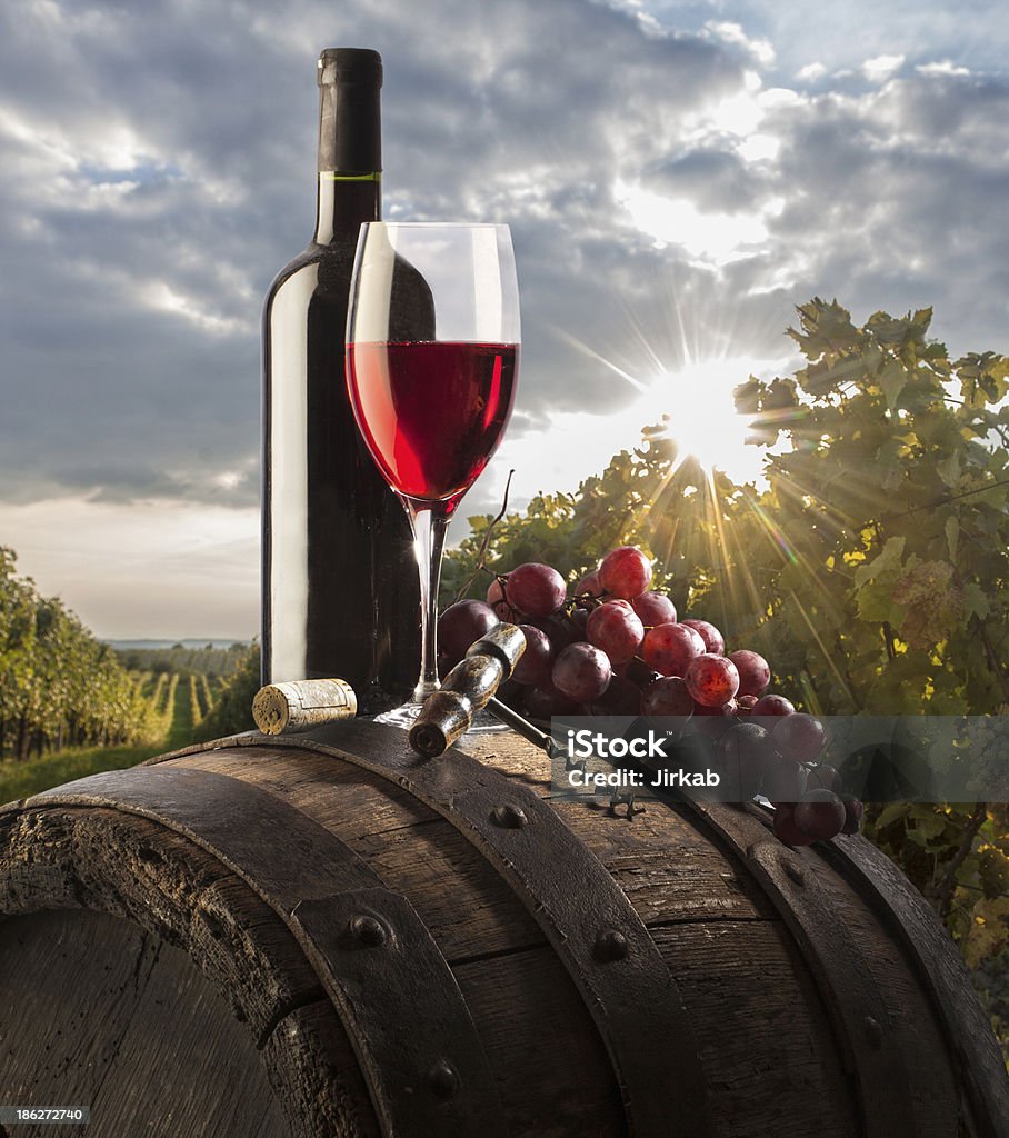 still life with red wine still life with glass red wine and bottle on wood barrel Barrel Stock Photo