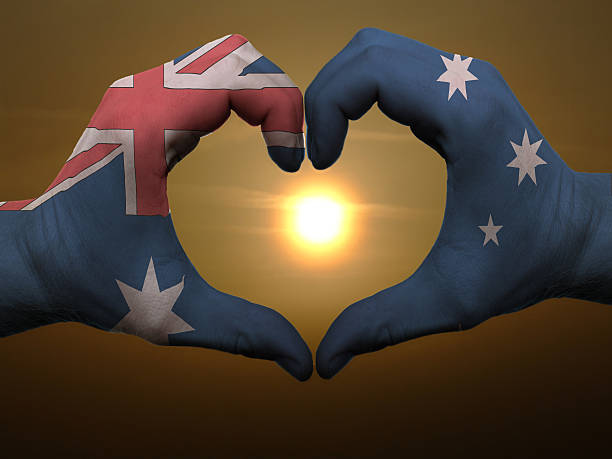 istock Heart and love gesture by hands colored in australia flag 186276273
