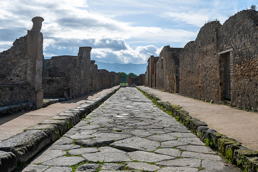 Ancient stone road with ruins in Pompeii