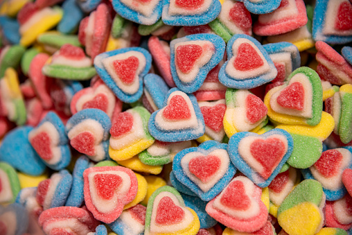 these peach candies are in a pile