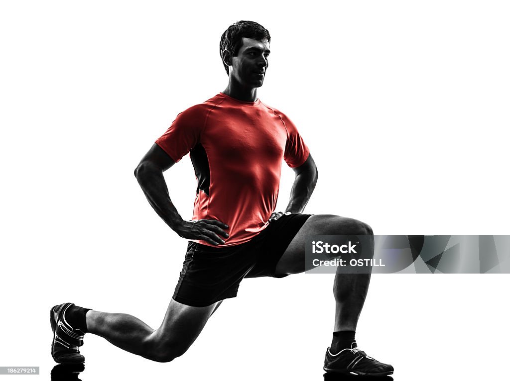 Computer image of a man doing lunges one man exercising fitness workout lunges crouching in silhouette isolated on white background Lunge Stock Photo