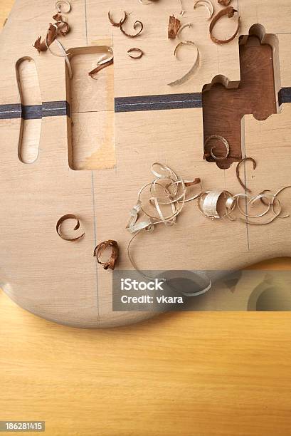 Bass Guitar Under Construction Stock Photo - Download Image Now - Acoustic Guitar, Backgrounds, Brown