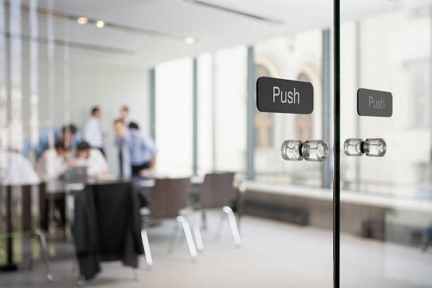 Transparent glass doors leading to office