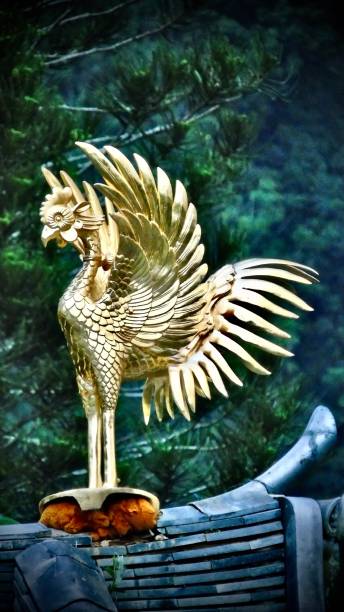 one gold encrusted mythological fènghuáng bird stands atop the byodo-in temple (平等院テンプル) on the island of o'ahu. o'ahu island, hawai'i - u.s.a. fenghuang county photos stock pictures, royalty-free photos & images